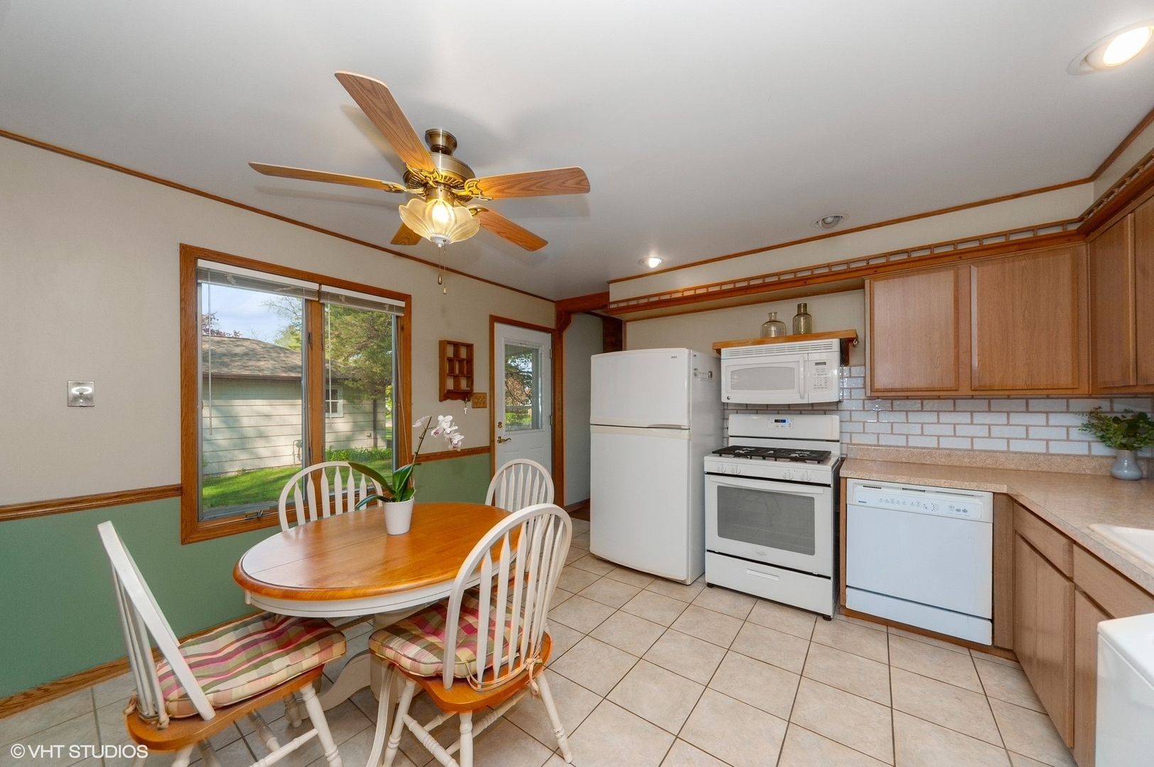 2305 Jay Lane Rolling Meadows, IL 60008 - Photo 5 of 18 a kitchen with furniture cabinets stainless steel appliances and a dining table
