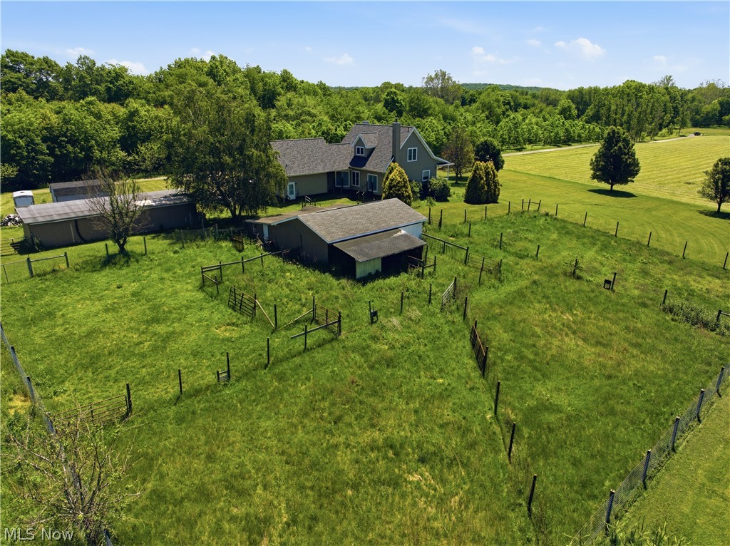 12159 Lawndell Road Southwest Beach City, OH 44608 - Photo 46 of 49 Expansive fenced pastures surrounding a two-story residence with multiple outbuildings and mature trees