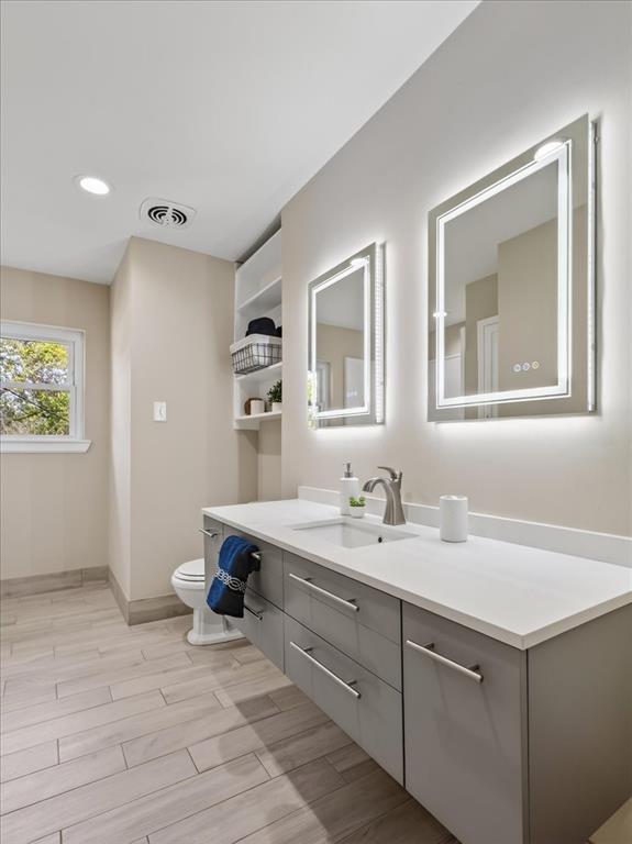3863 Clayton Road East Fort Worth, TX 76116 - Photo 30 of 39 a spacious bathroom with a double vanity sink and a mirror