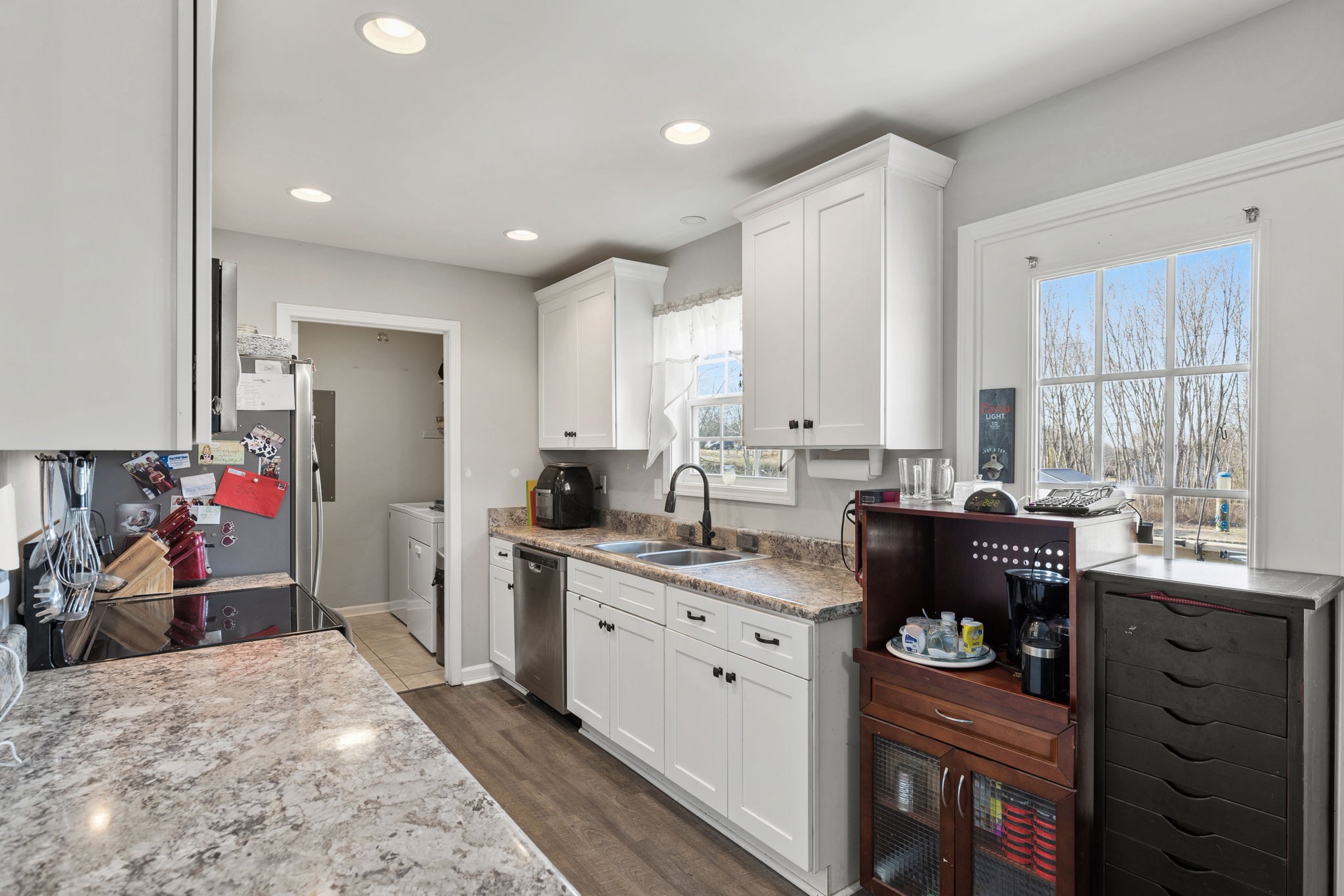 6491 Highway 161 Springfield, TN 37172 - Photo 15 of 32 a kitchen that has a lot of cabinets in it and wooden floors