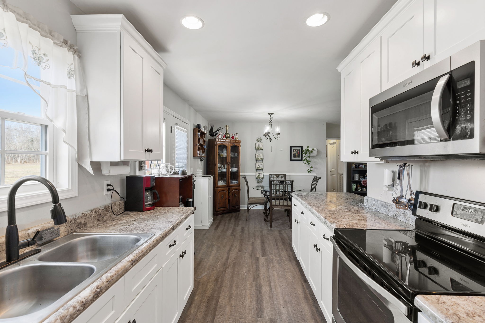 6491 Highway 161 Springfield, TN 37172 - Photo 16 of 32 a large kitchen with a stove top oven a sink a counter space and cabinets
