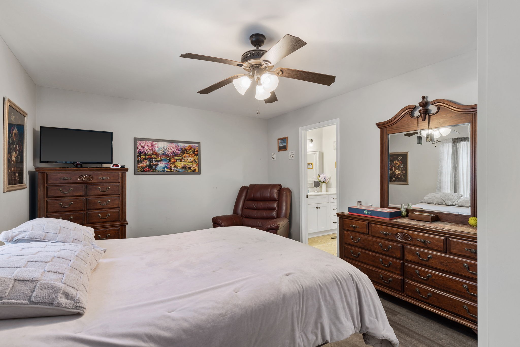 6491 Highway 161 Springfield, TN 37172 - Photo 18 of 32 a bedroom with a bed and dresser with mirror