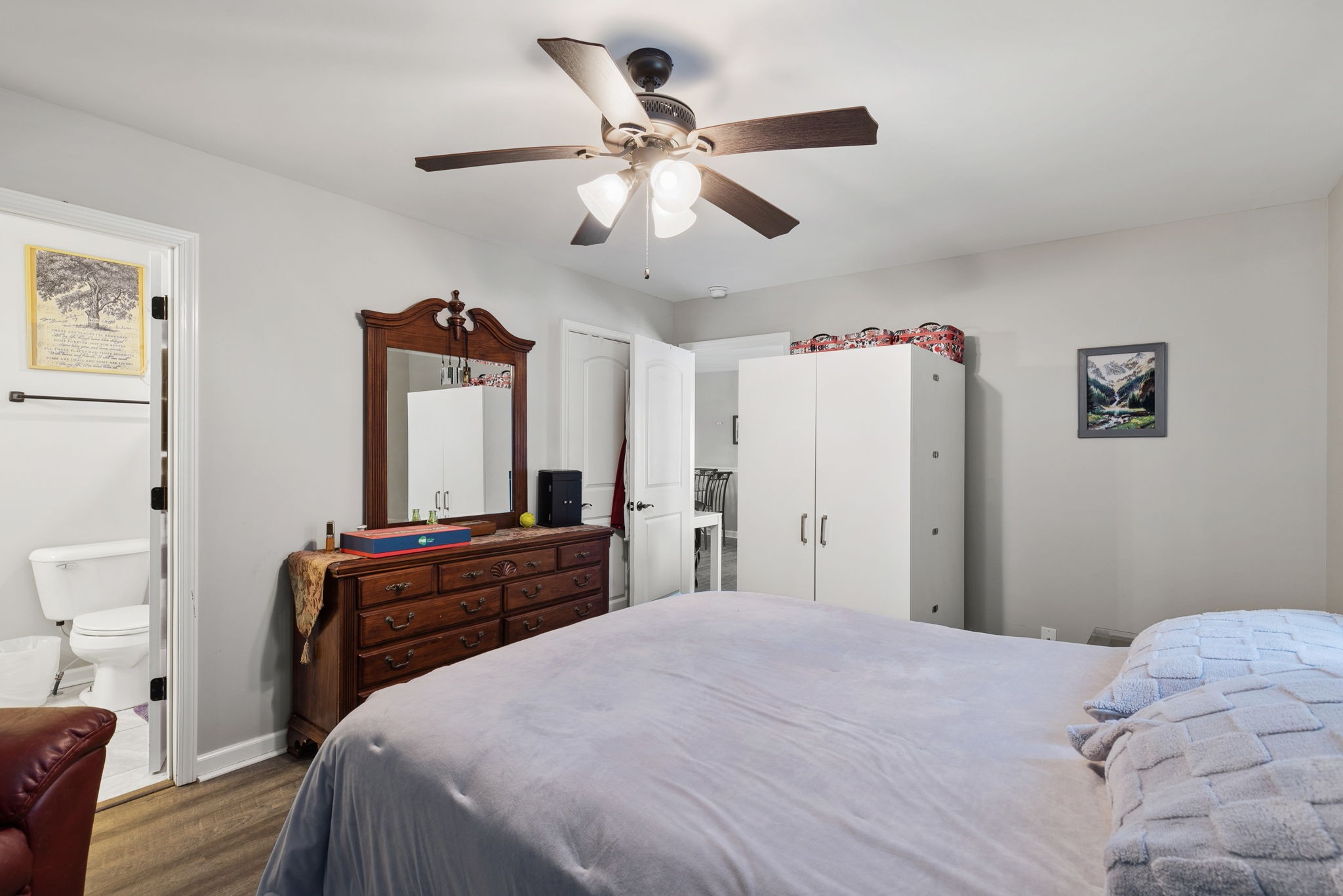 6491 Highway 161 Springfield, TN 37172 - Photo 19 of 32 a bedroom with a bed and a chandelier
