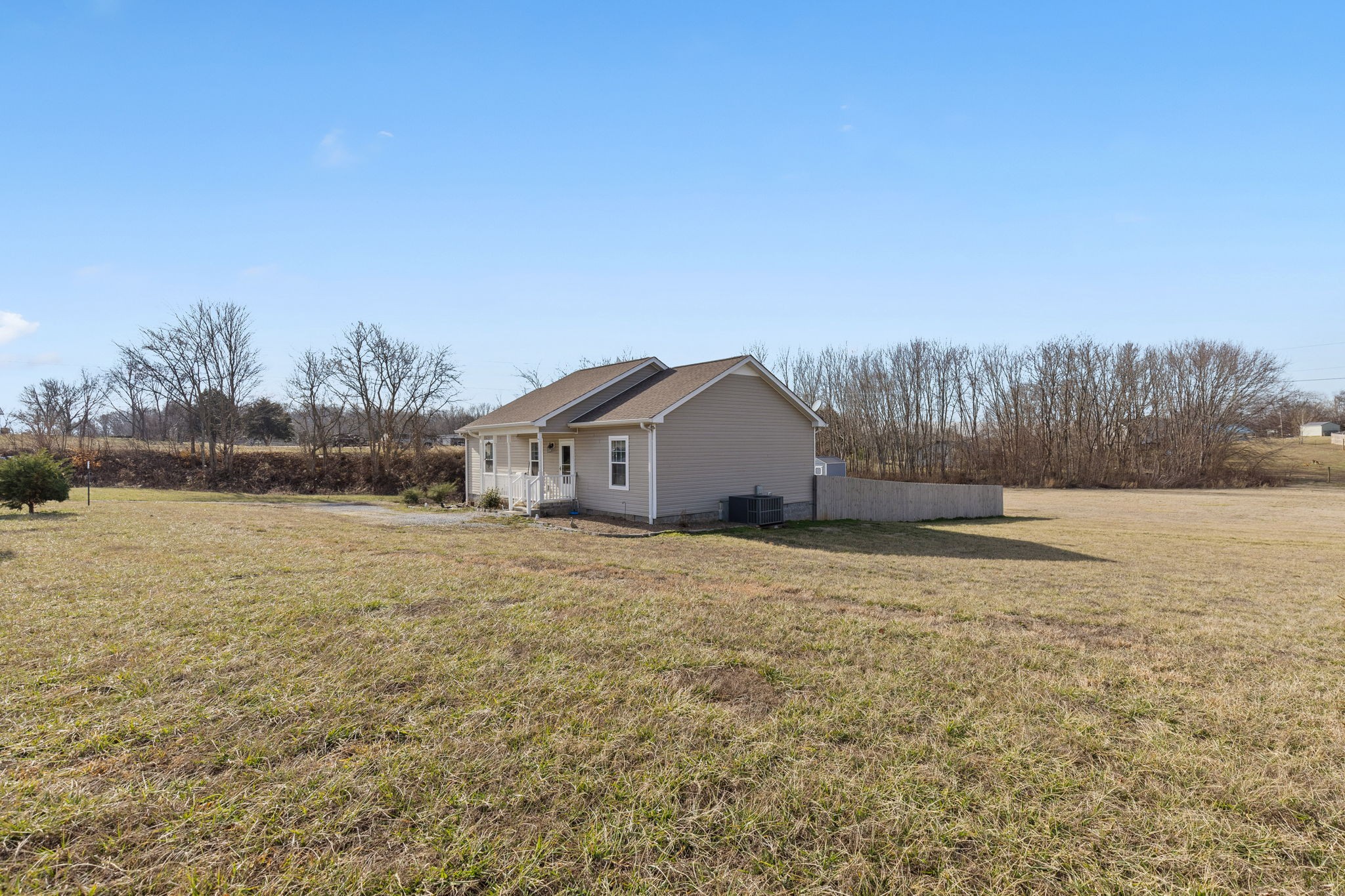6491 Highway 161 Springfield, TN 37172 - Photo 4 of 32 a front view of a house with a yard and trees