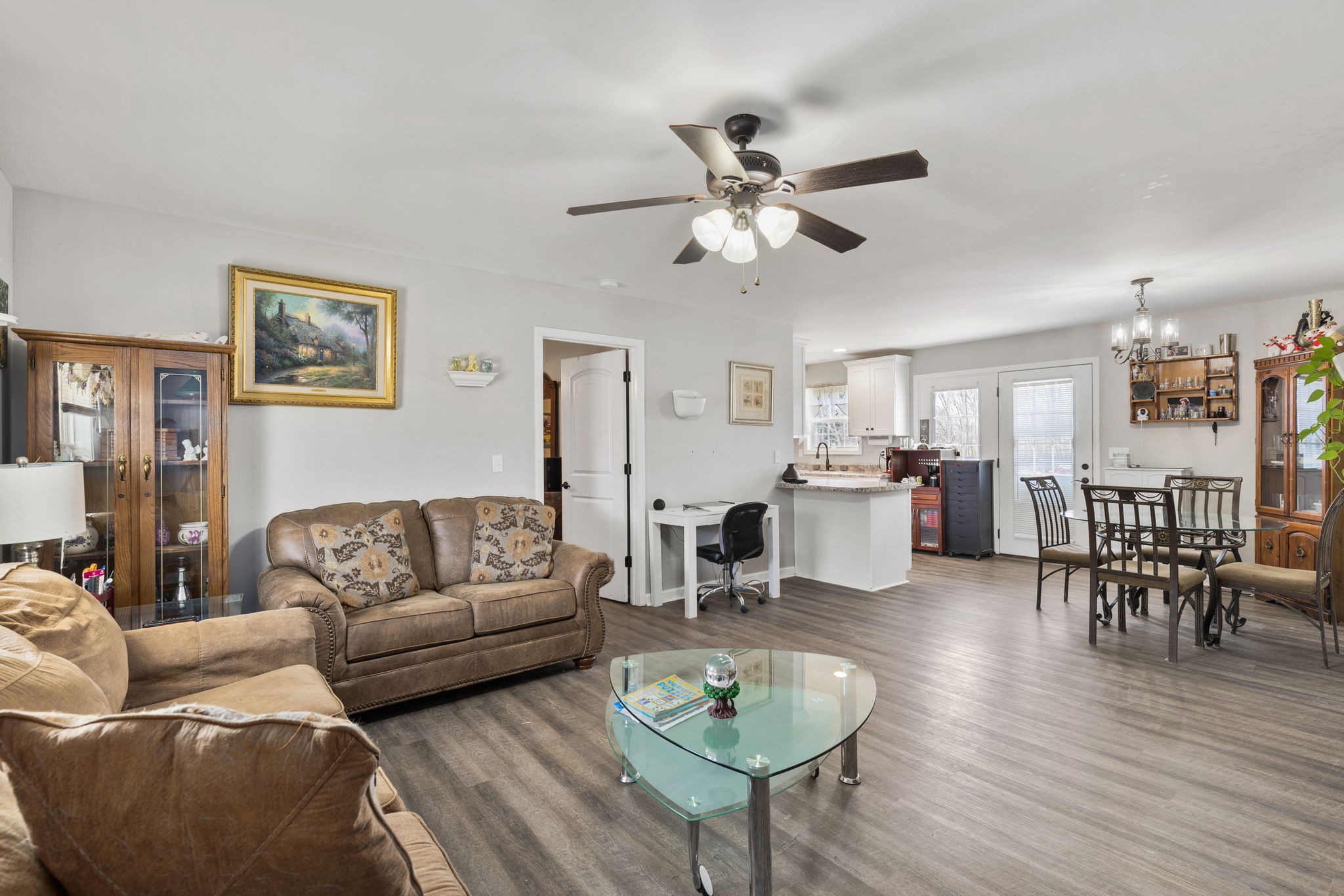 6491 Highway 161 Springfield, TN 37172 - Photo 5 of 32 a living room with furniture a wooden floor and a chandelier