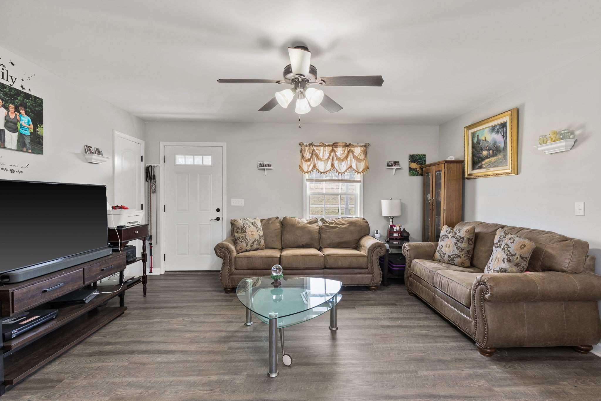 6491 Highway 161 Springfield, TN 37172 - Photo 7 of 32 a living room with furniture a flat screen tv and a window