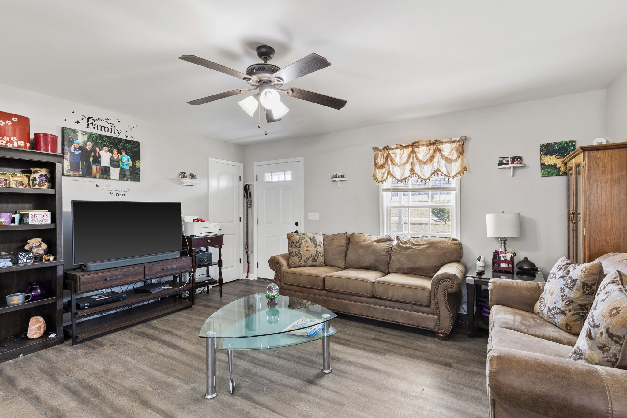 6491 Highway 161 Springfield, TN 37172 - Photo 8 of 32 a living room with furniture and a flat screen tv with wooden floor