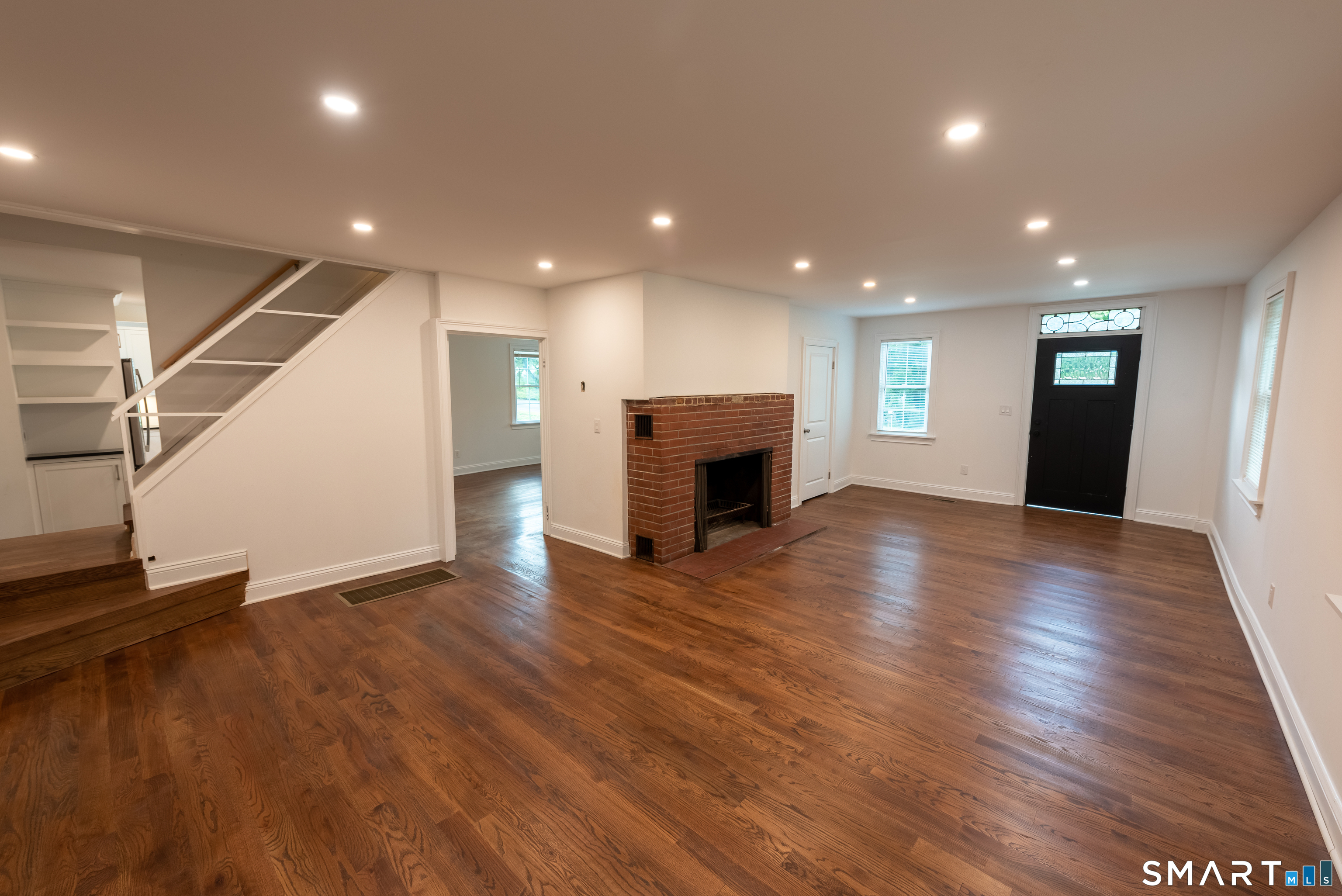 148 Ripton Road Shelton, CT 06484 - Photo 8 of 40 Living room with classic brick fireplace