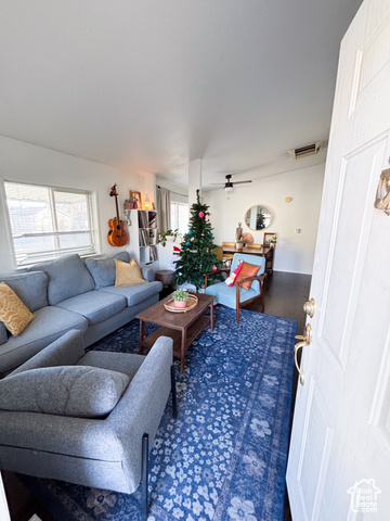 Undisclosed Address Provo, UT 84606 - Photo 1 of 1 Living area with ceiling fan, visible vents, and wood finished floors