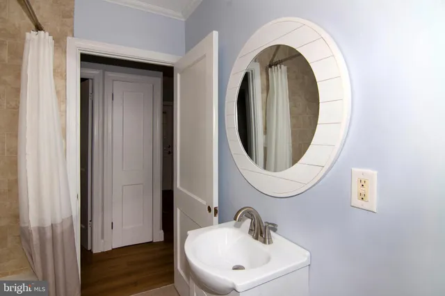 a bathroom with a sink and a mirror