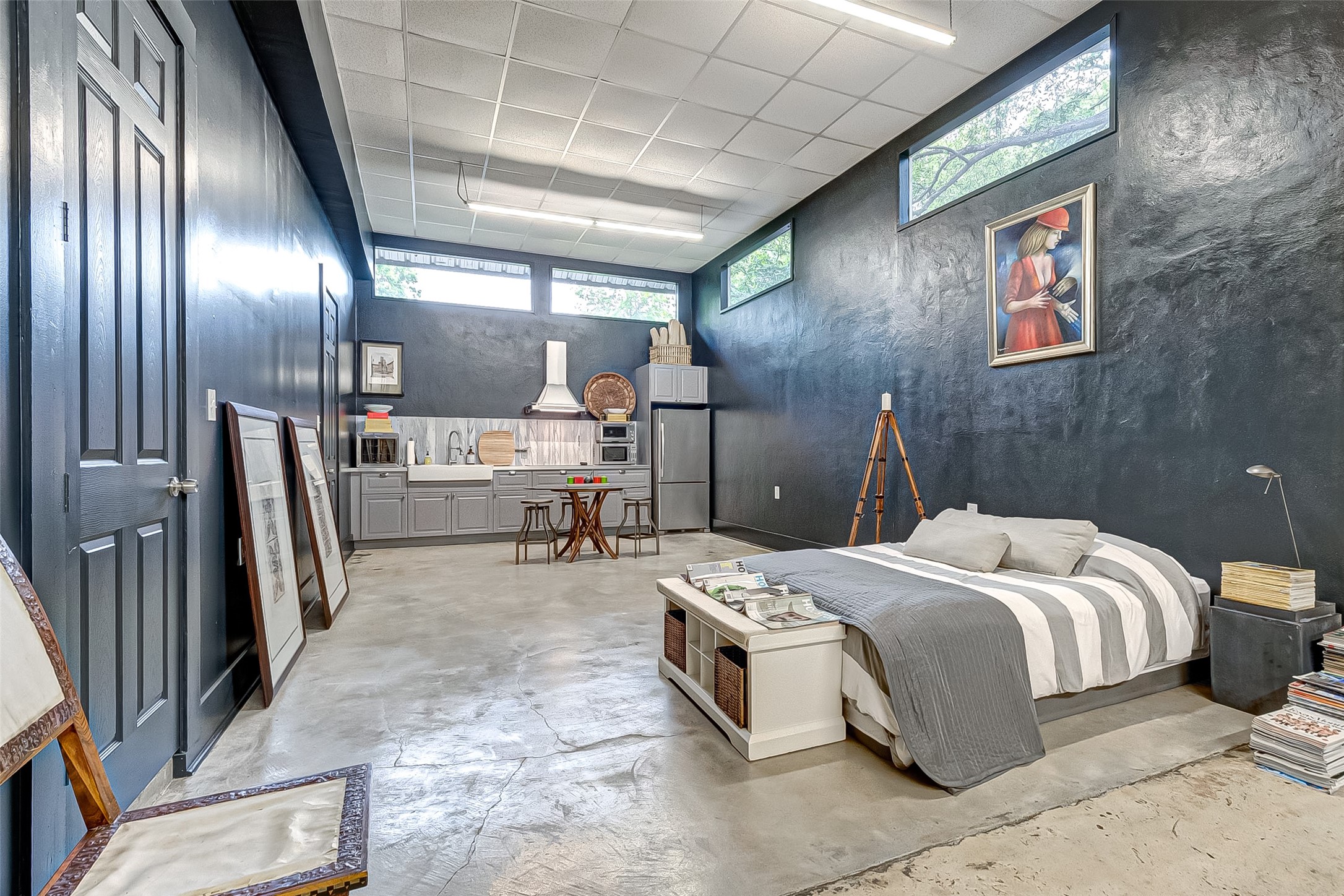 1612 West Alabama Street, Unit ABCD Houston, TX 77006 - Photo 2 of 50 a bed room with a bed and a large mirror