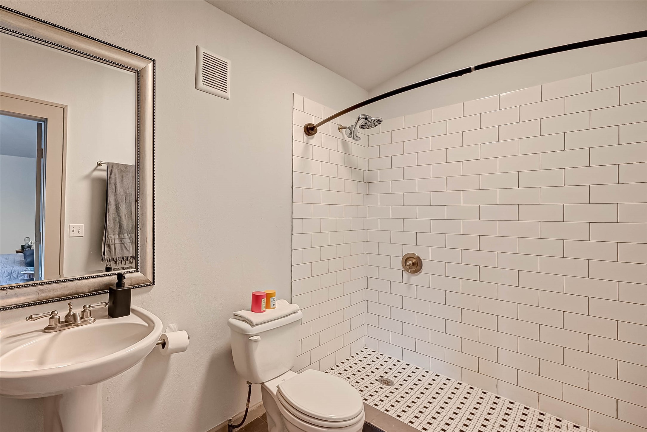 1612 West Alabama Street, Unit ABCD Houston, TX 77006 - Photo 32 of 50 a bathroom with a sink a toilet and a mirror