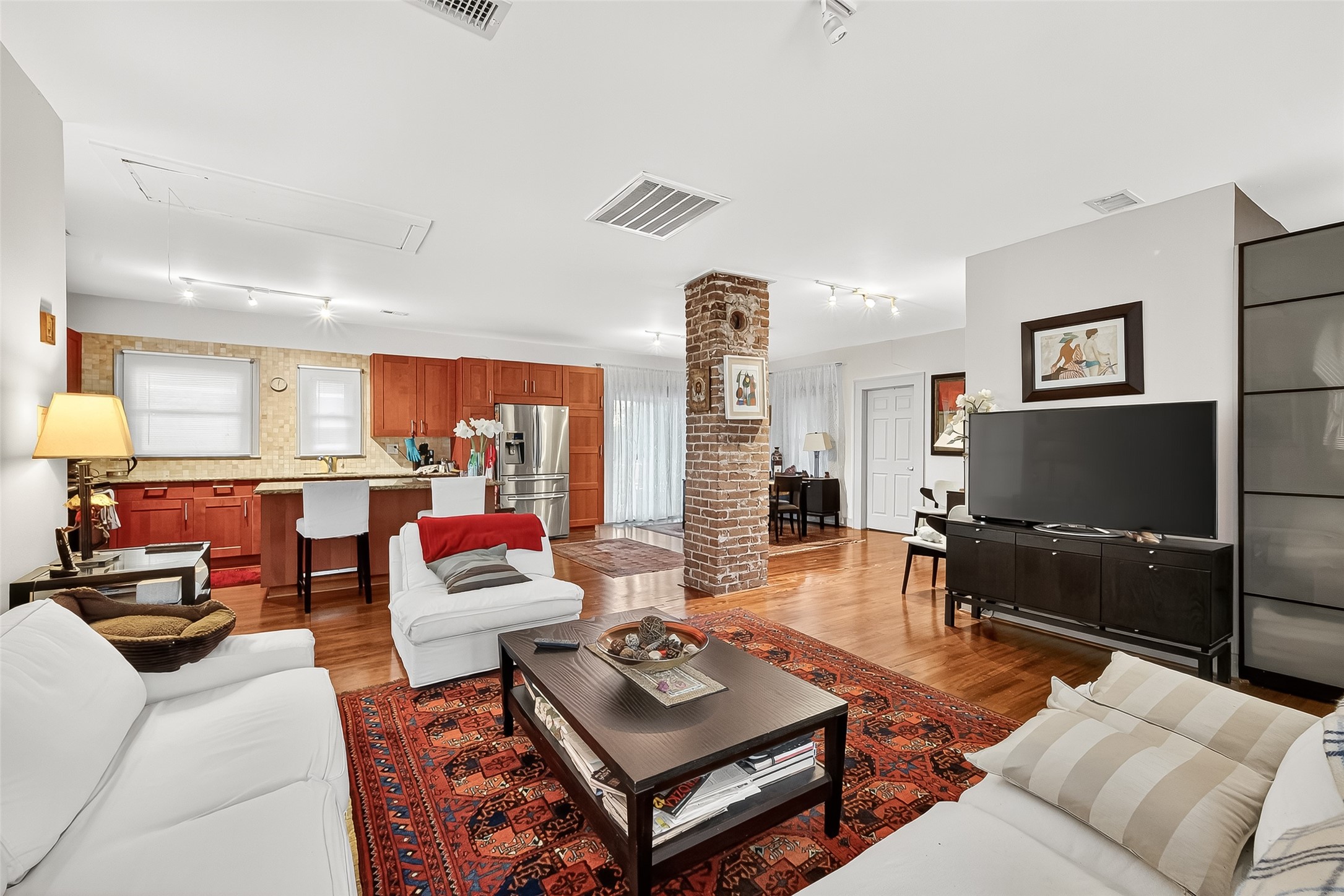 1612 West Alabama Street, Unit ABCD Houston, TX 77006 - Photo 37 of 50 a living room with furniture and a flat screen tv