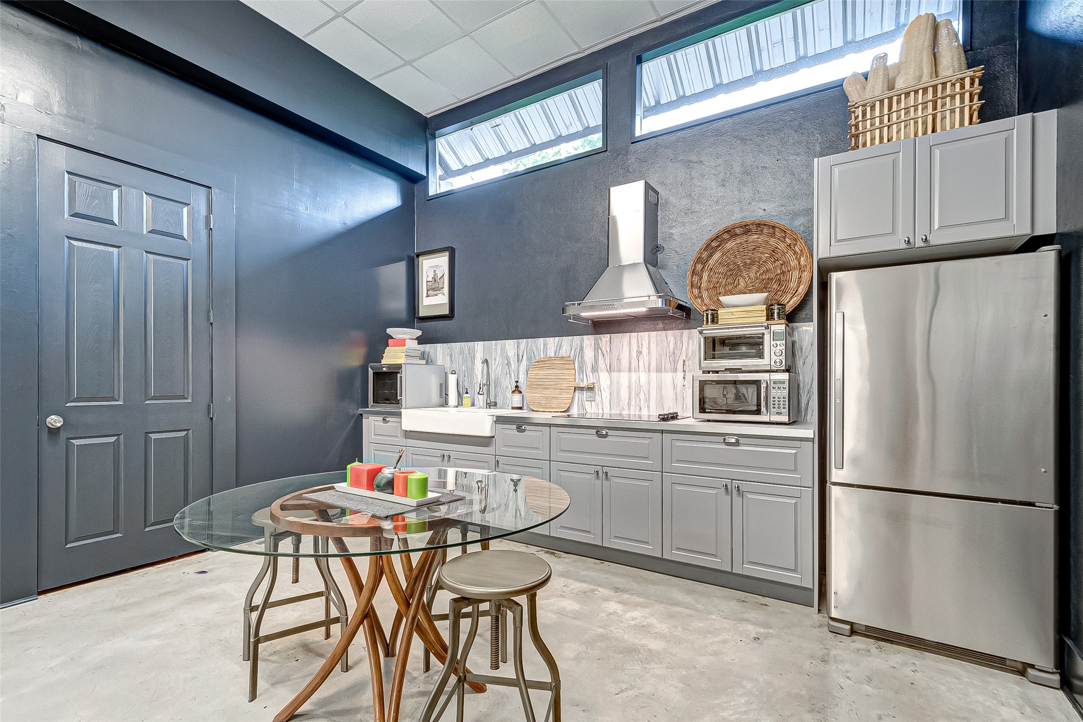 1612 West Alabama Street, Unit ABCD Houston, TX 77006 - Photo 5 of 50 a kitchen with stainless steel appliances a refrigerator a sink a stove and white cabinets