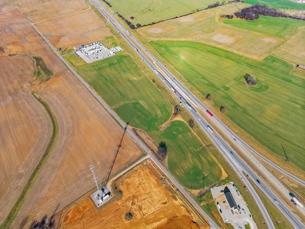 a view of a pool deck with a yard
