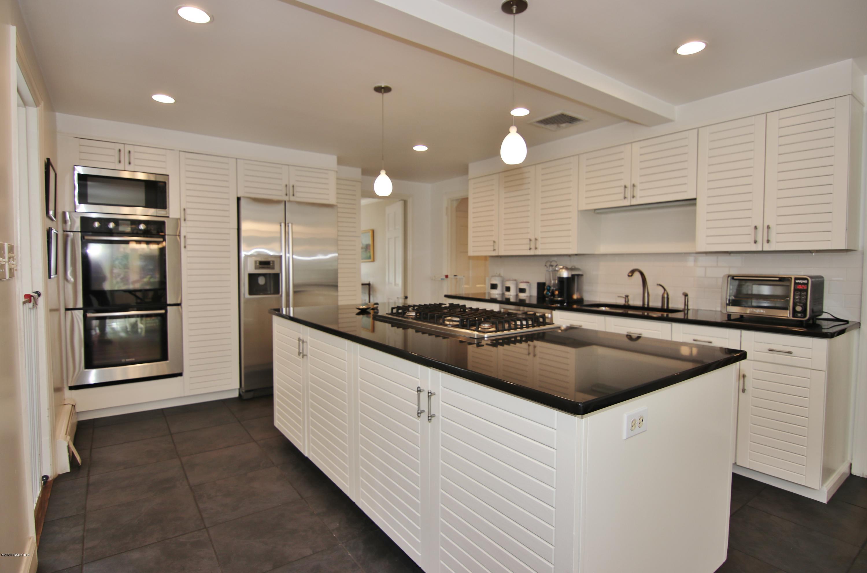 24 Crescent Road Riverside, CT 06878 - Photo 11 of 39 a kitchen that has a sink and cabinets