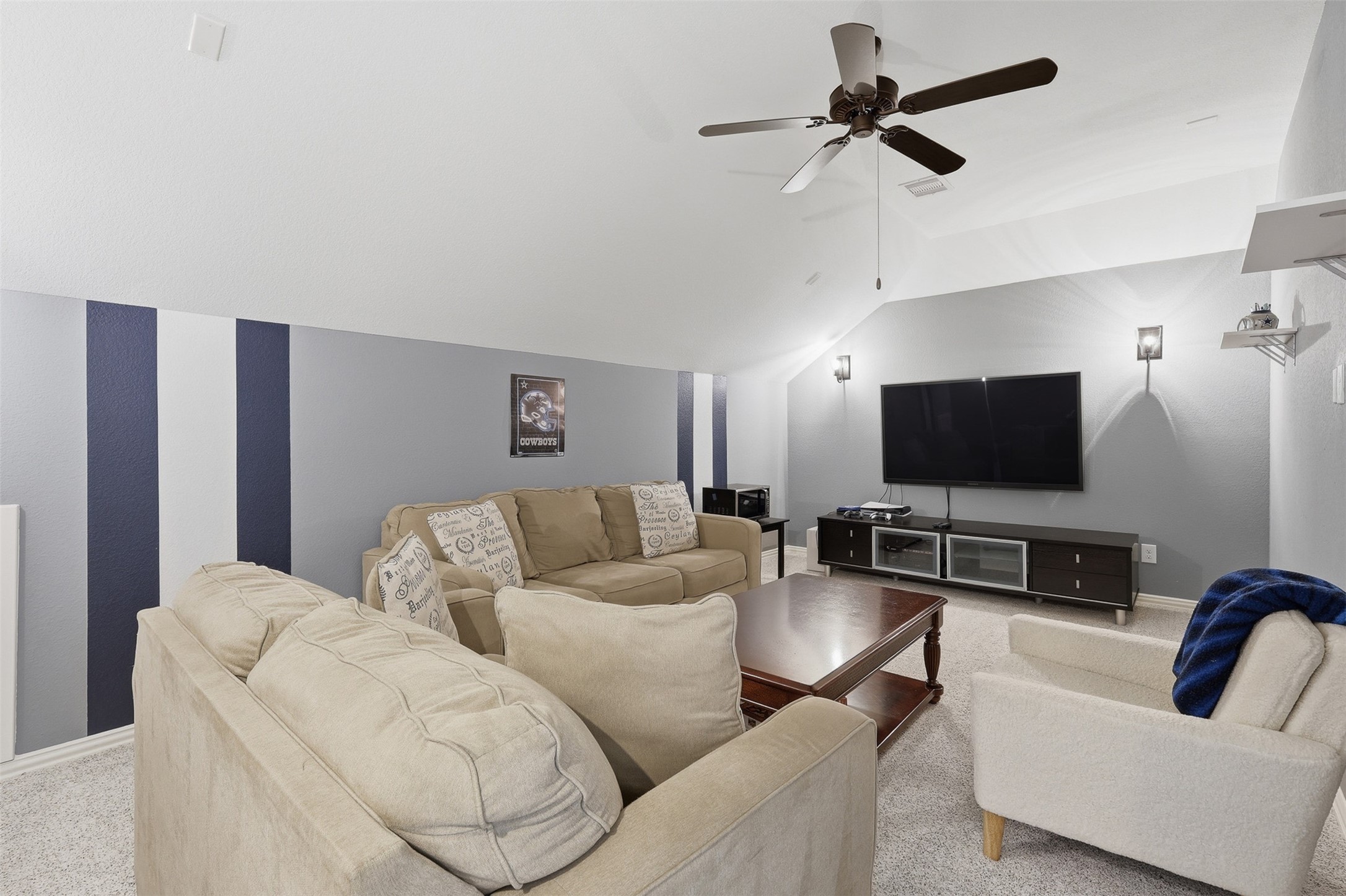 6835 Preston Grove Drive Spring, TX 77389 - Photo 35 of 49 a living room with furniture and a flat screen tv