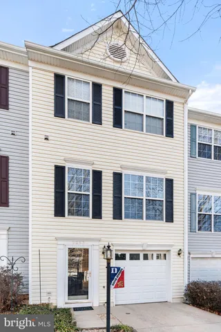 a front view of a house with garage
