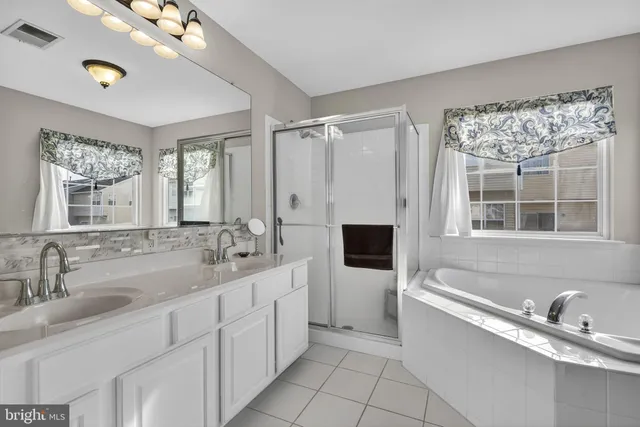 a white bath tub sitting in a bathroom