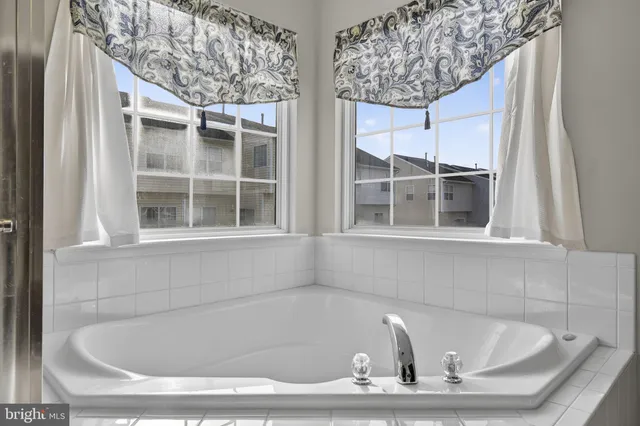 a bathroom with a sink double vanity and a mirror