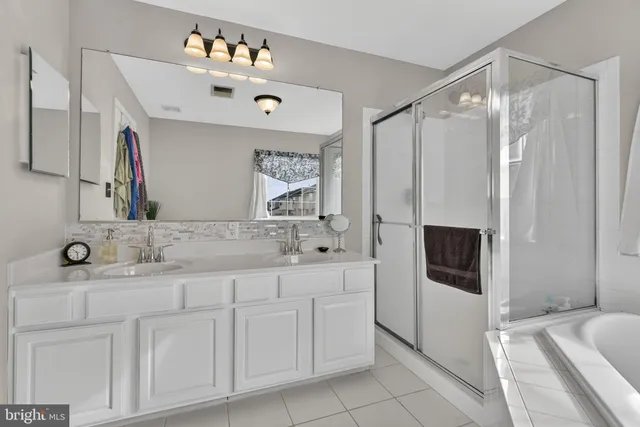 a view of a hallway with a livingroom and furniture