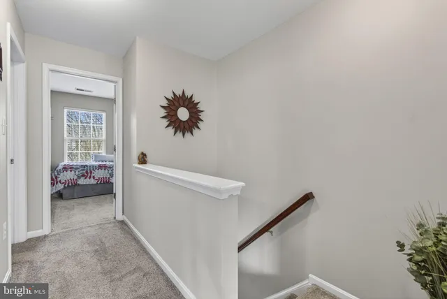 a bathroom with a sink vanity mirror and toilet