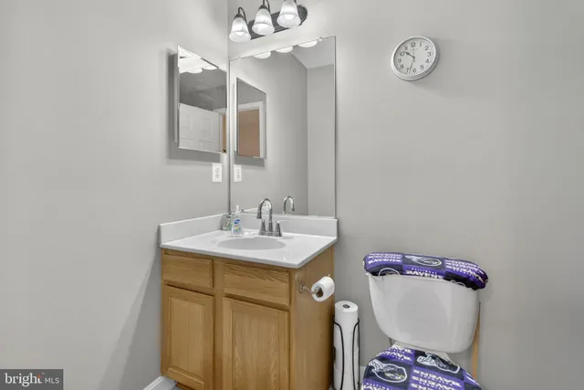 a bedroom with a bed window and dresser