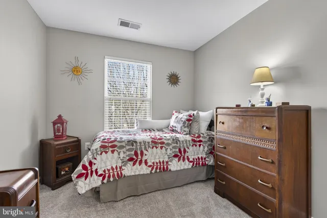 a bedroom with a bed and closet