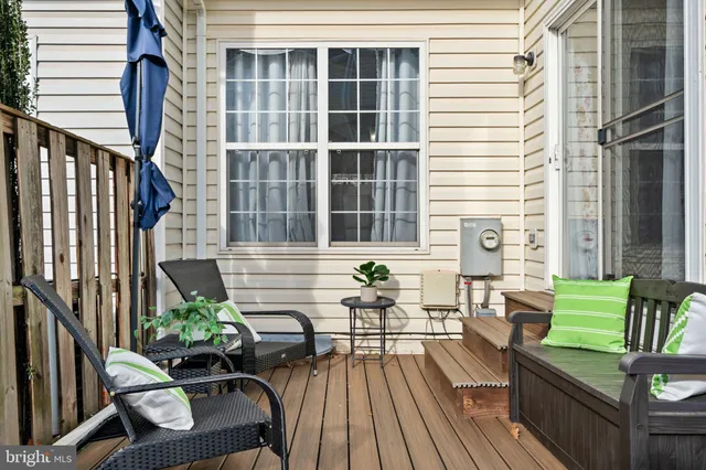 a view of a house with a wooden fence