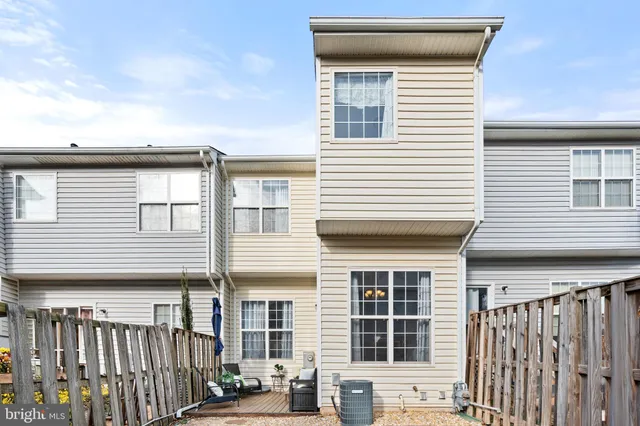 a front view of a house with large windows