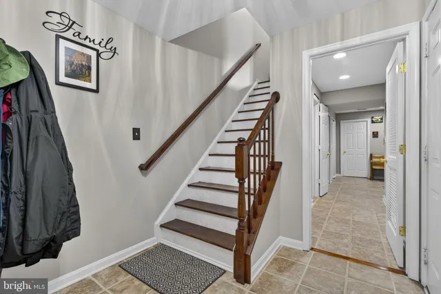 a view of entryway with stairs and wooden floor