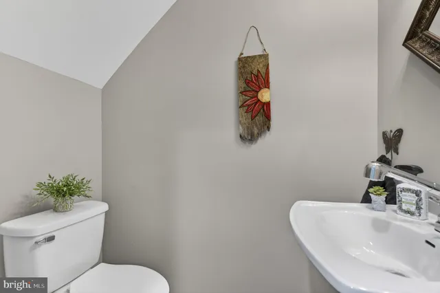 a bathroom with a toilet and a sink