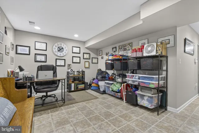 a living room with lots of furniture and a flat screen tv