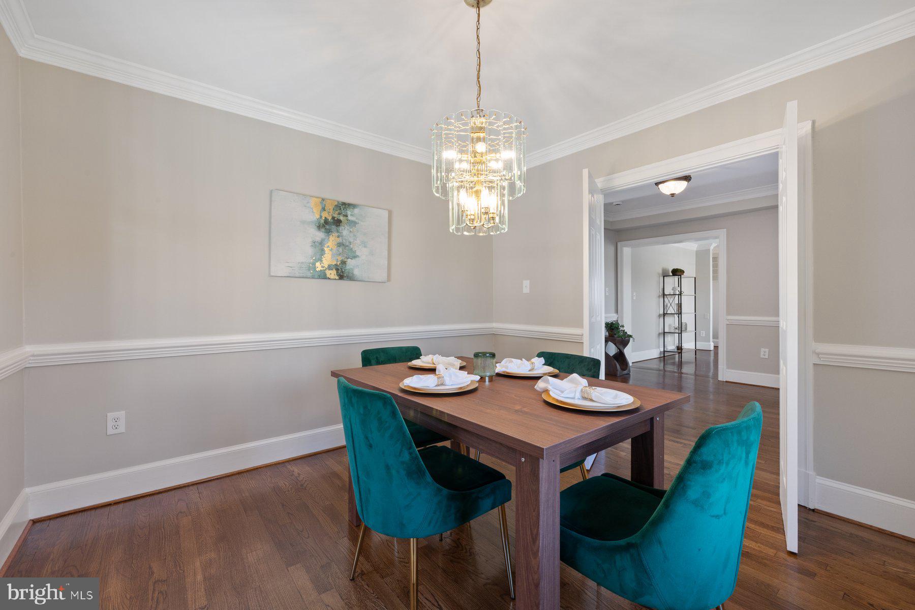 7005 Beacon Light Road Riverdale, MD 20737 - Photo 11 of 45 a view of a dining room with furniture window and wooden floor