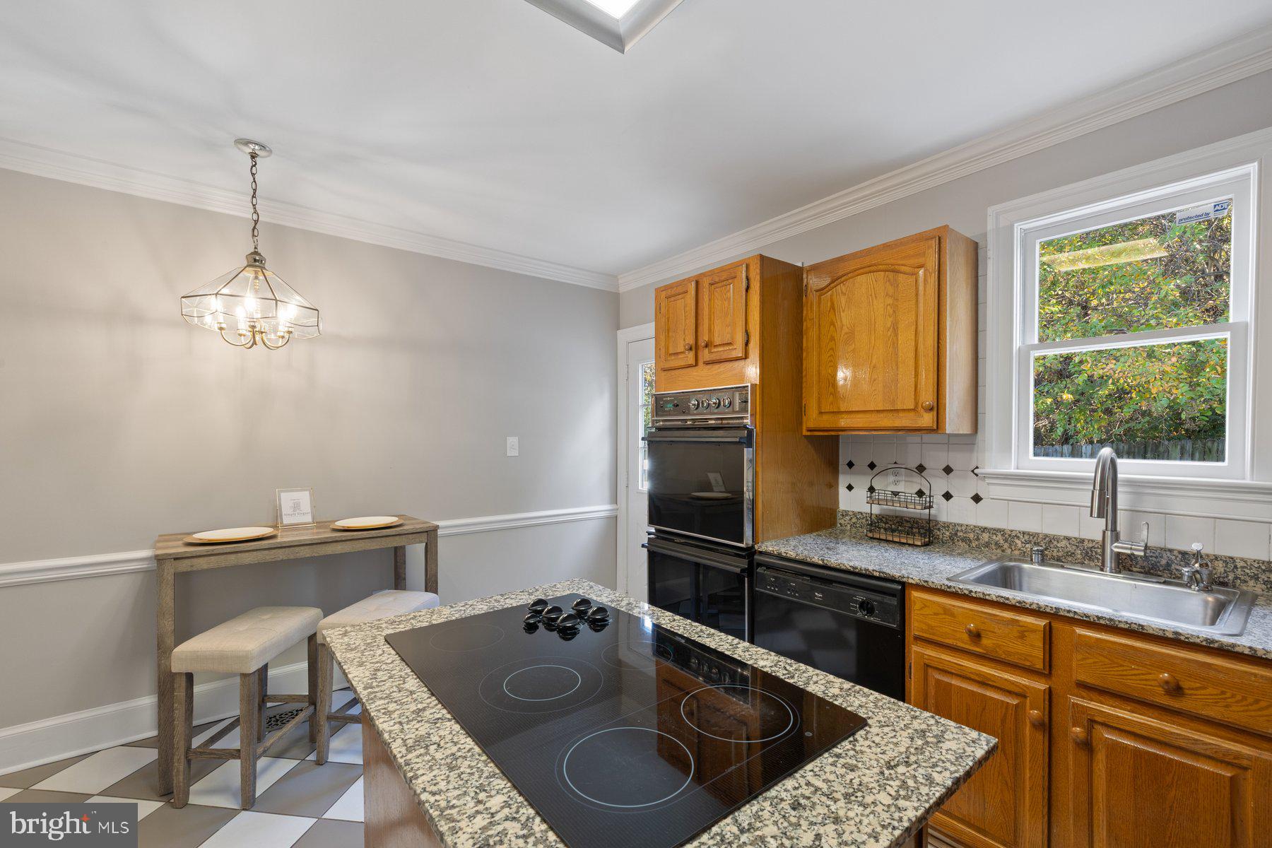 7005 Beacon Light Road Riverdale, MD 20737 - Photo 15 of 45 a kitchen with a sink and a stove