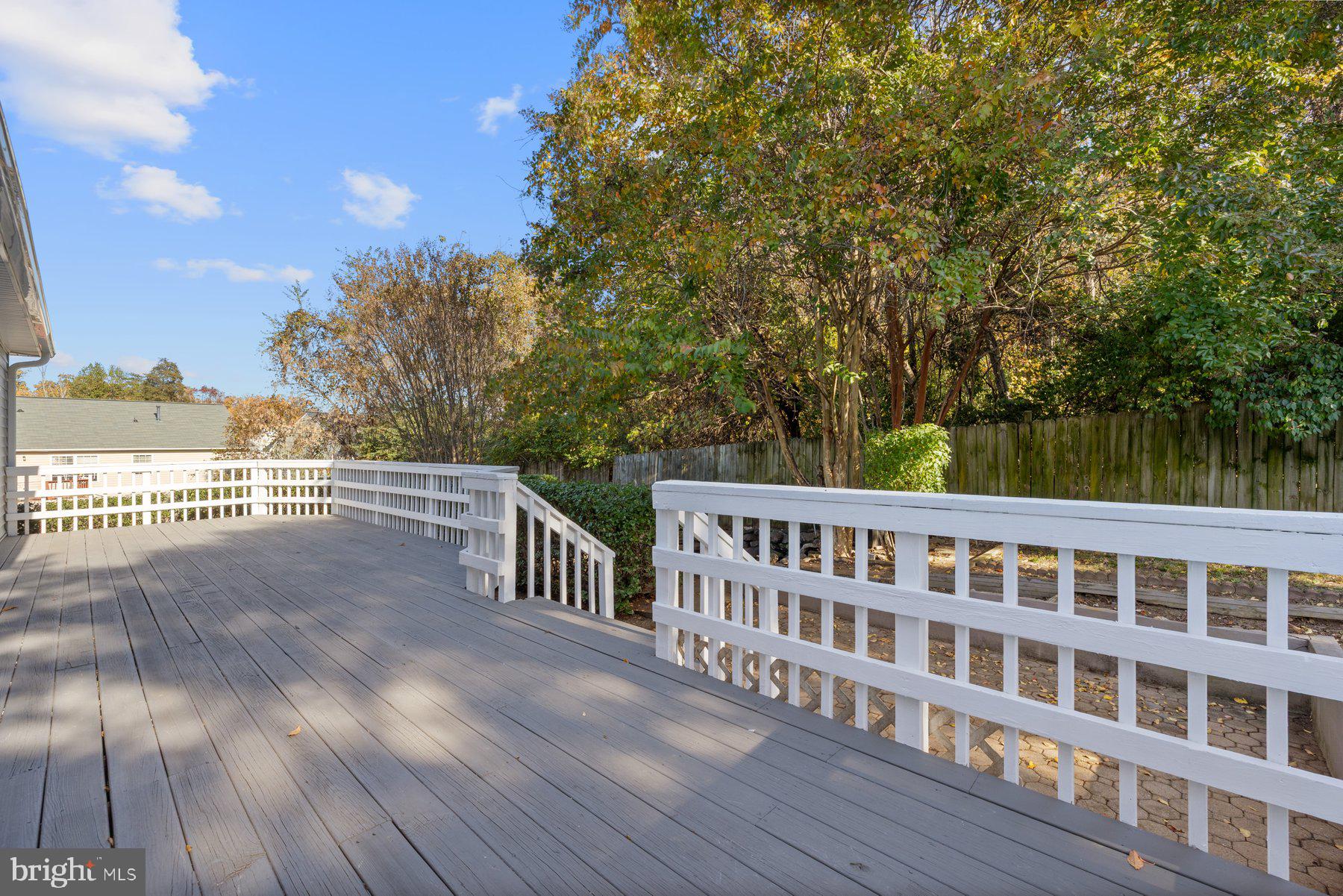 7005 Beacon Light Road Riverdale, MD 20737 - Photo 16 of 45 a view of a balcony with wooden floor and fence