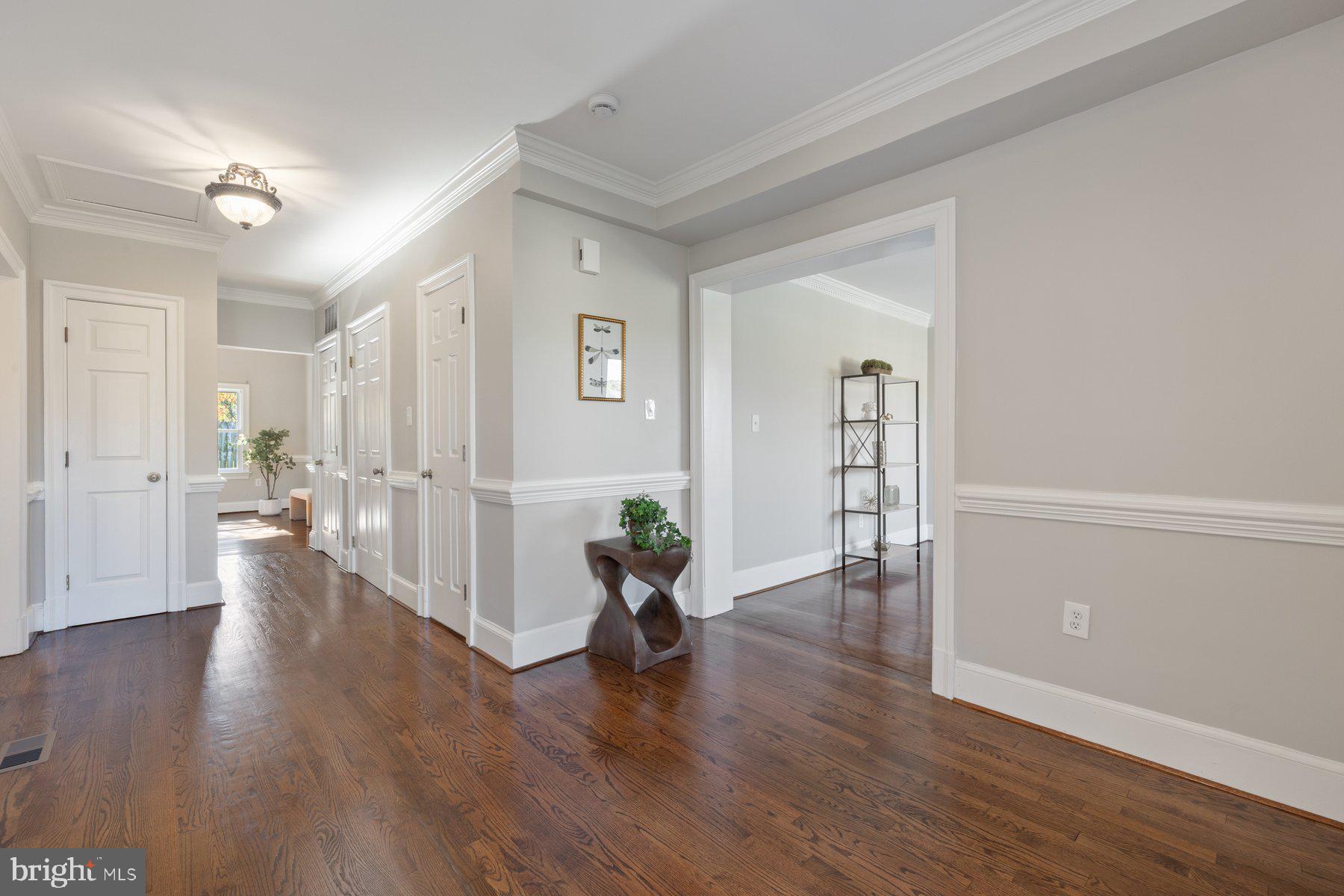 7005 Beacon Light Road Riverdale, MD 20737 - Photo 2 of 45 a view of an empty room and wooden floor