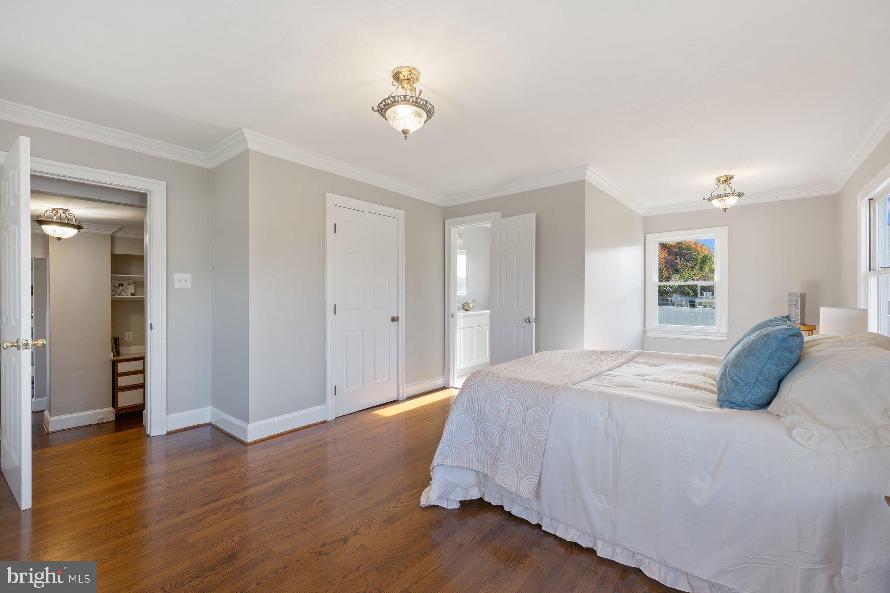 7005 Beacon Light Road Riverdale, MD 20737 - Photo 25 of 45 a bedroom with a bed and wooden floor