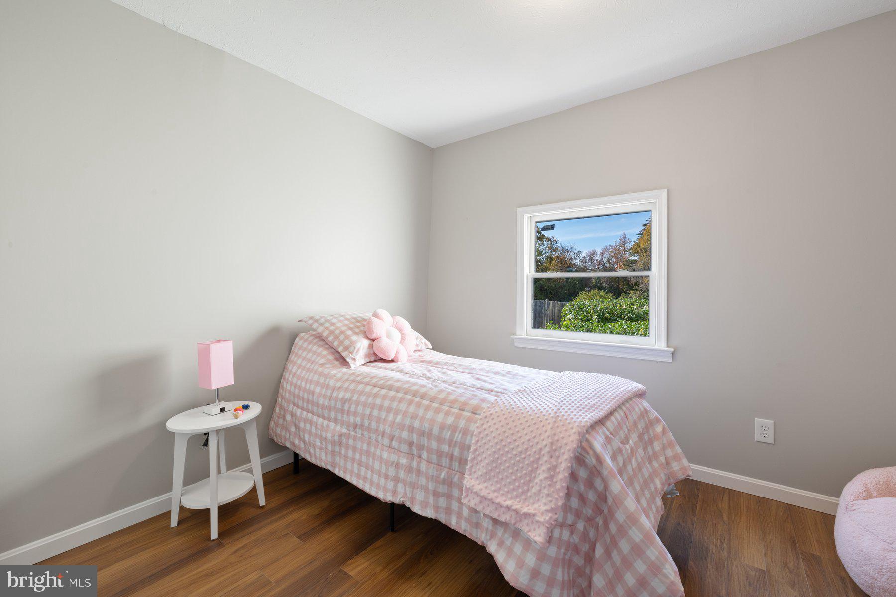 7005 Beacon Light Road Riverdale, MD 20737 - Photo 31 of 45 a bedroom with a bed and a window