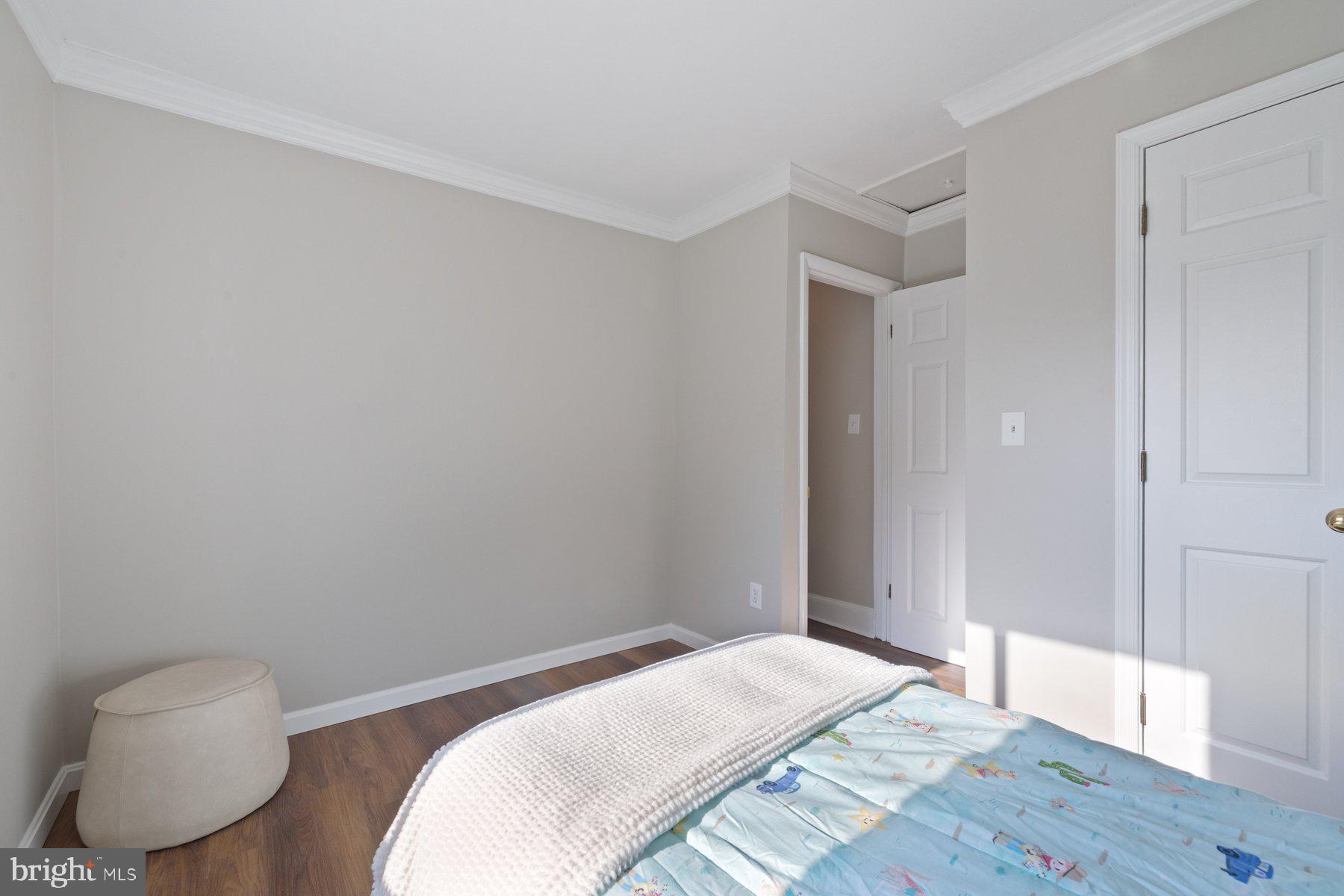 7005 Beacon Light Road Riverdale, MD 20737 - Photo 34 of 45 a bedroom with a bed and a chair