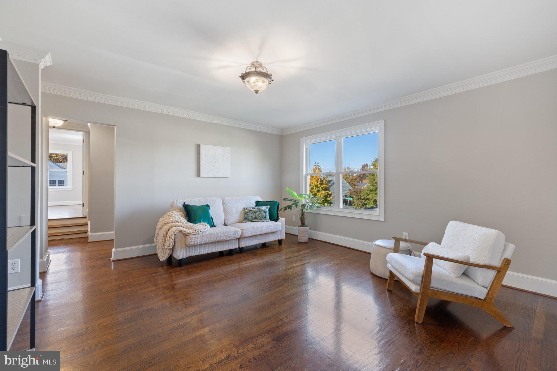7005 Beacon Light Road Riverdale, MD 20737 - Photo 9 of 45 a living room with furniture and a wooden floor