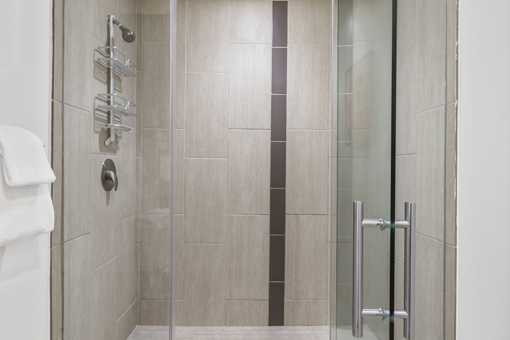 3550 Main Street, Unit 5301 Houston, TX 77002 - Photo 8 of 49 Walk-in shower with seamless glass, modern tile, and sleek metal fixtures.