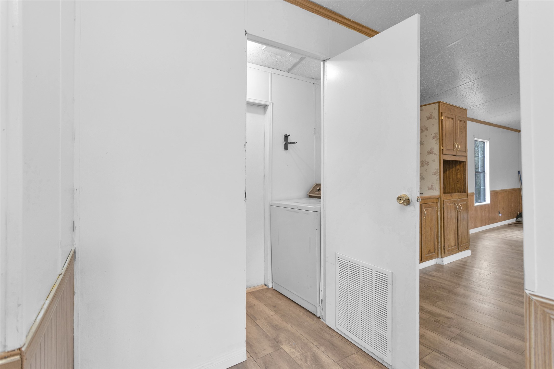 4794 Tall Pine Road Navasota, TX 77868 - Photo 14 of 34 a view of a hallway with wooden floor