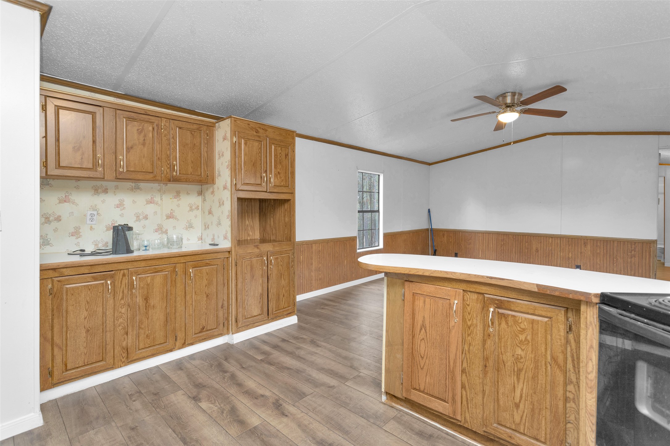 4794 Tall Pine Road Navasota, TX 77868 - Photo 20 of 34 a kitchen with stainless steel appliances granite countertop a sink a stove cabinets and wooden floor