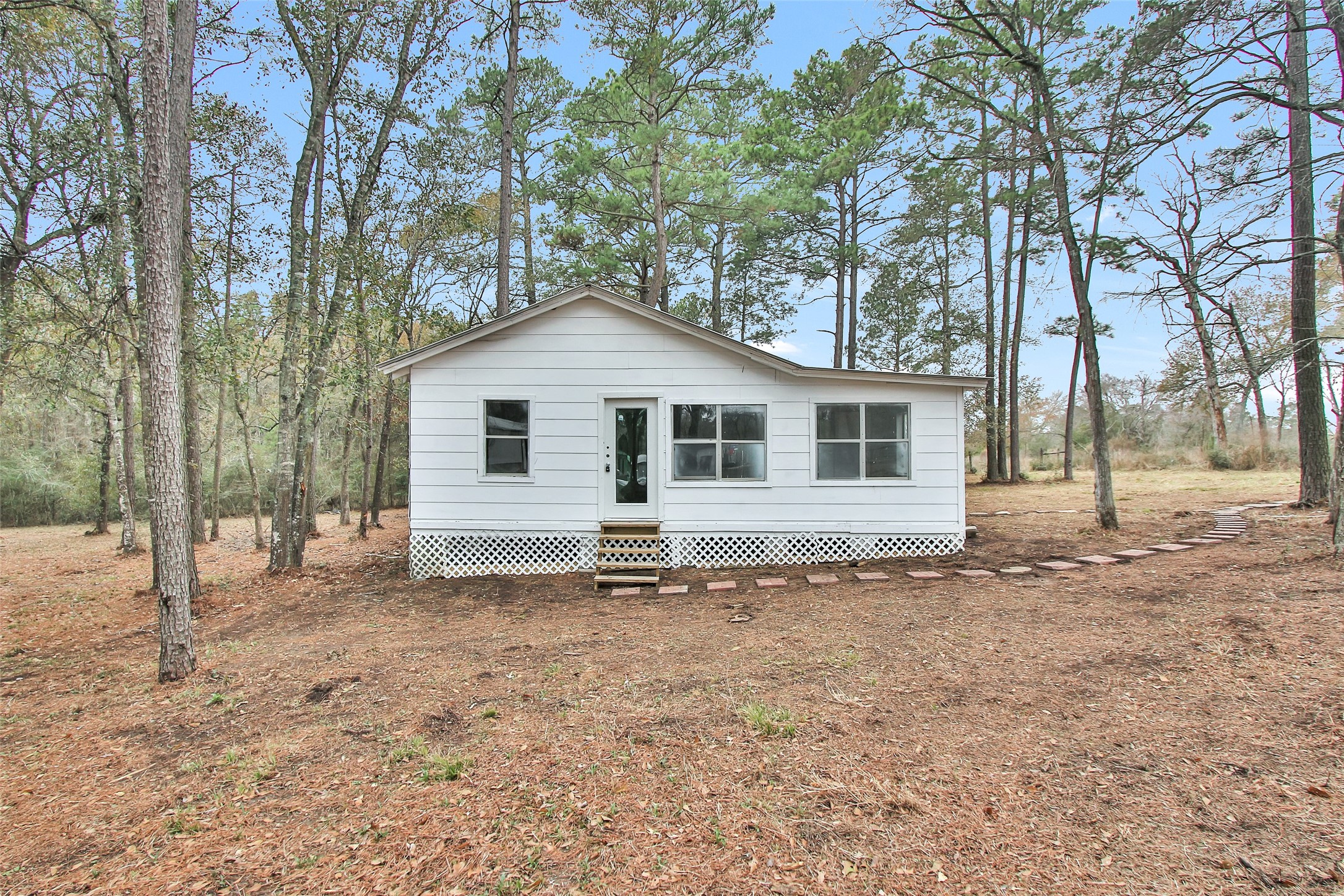 4794 Tall Pine Road Navasota, TX 77868 - Photo 24 of 34 a view of a house with a yard