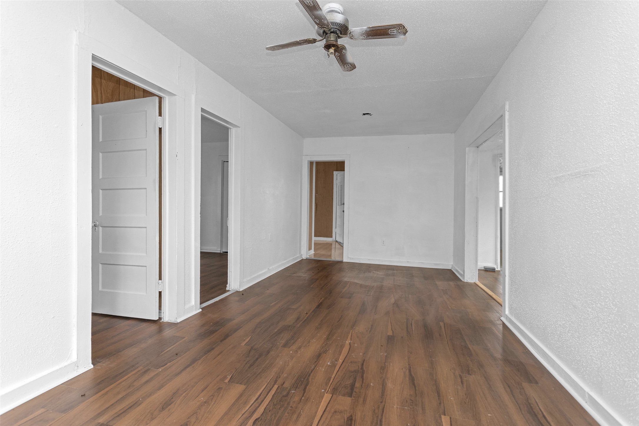 4794 Tall Pine Road Navasota, TX 77868 - Photo 28 of 34 an empty room with wooden floor and windows