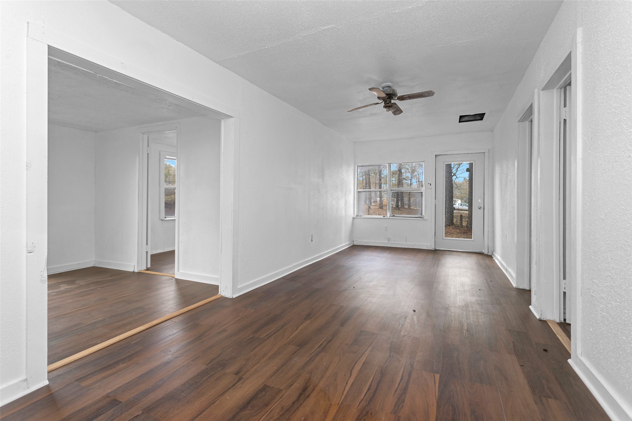 4794 Tall Pine Road Navasota, TX 77868 - Photo 29 of 34 wooden floor in an empty room with a window