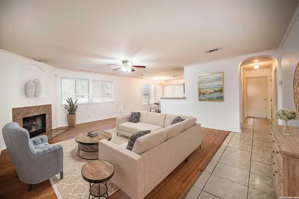 a living room with furniture and a fireplace