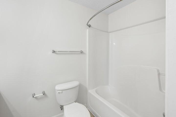 361 Crooked Pine Trail Crestview, FL 32539 - Photo 11 of 14 a white toilet sitting next to a bath tub