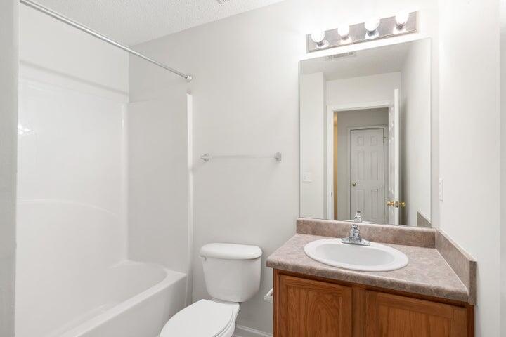 361 Crooked Pine Trail Crestview, FL 32539 - Photo 7 of 14 a bathroom with a granite countertop sink toilet and shower